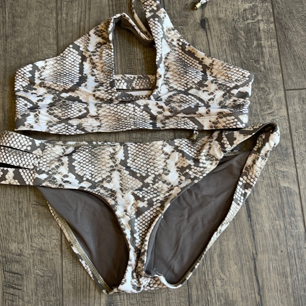 Vitamin A snakeskin suit. New